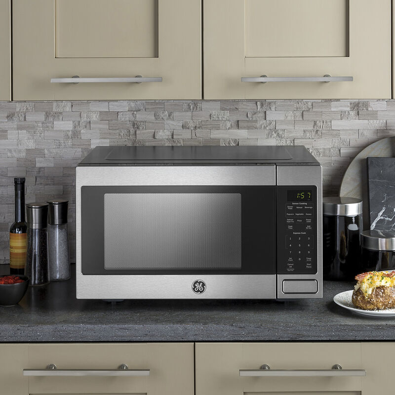 GE 2-cu ft 1200-Watt Sensor Cooking Controls Countertop Microwave (Black)  in the Countertop Microwaves department at