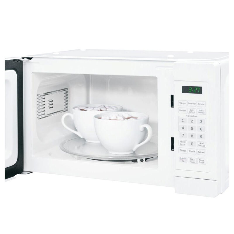 Highland 0.7-cu ft 700-Watt Countertop Microwave (Cream) in the Countertop  Microwaves department at