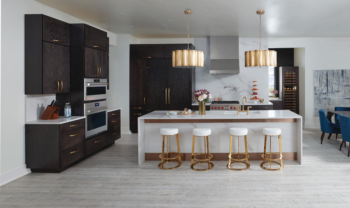 Sub-Zero Lifestyle Kitchen view featuring refrigerator model CL3650UFD/O with custom dark wood panels, overlay flush install