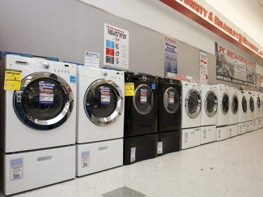 Row of dryers on display in a P.C. Richard & Son store